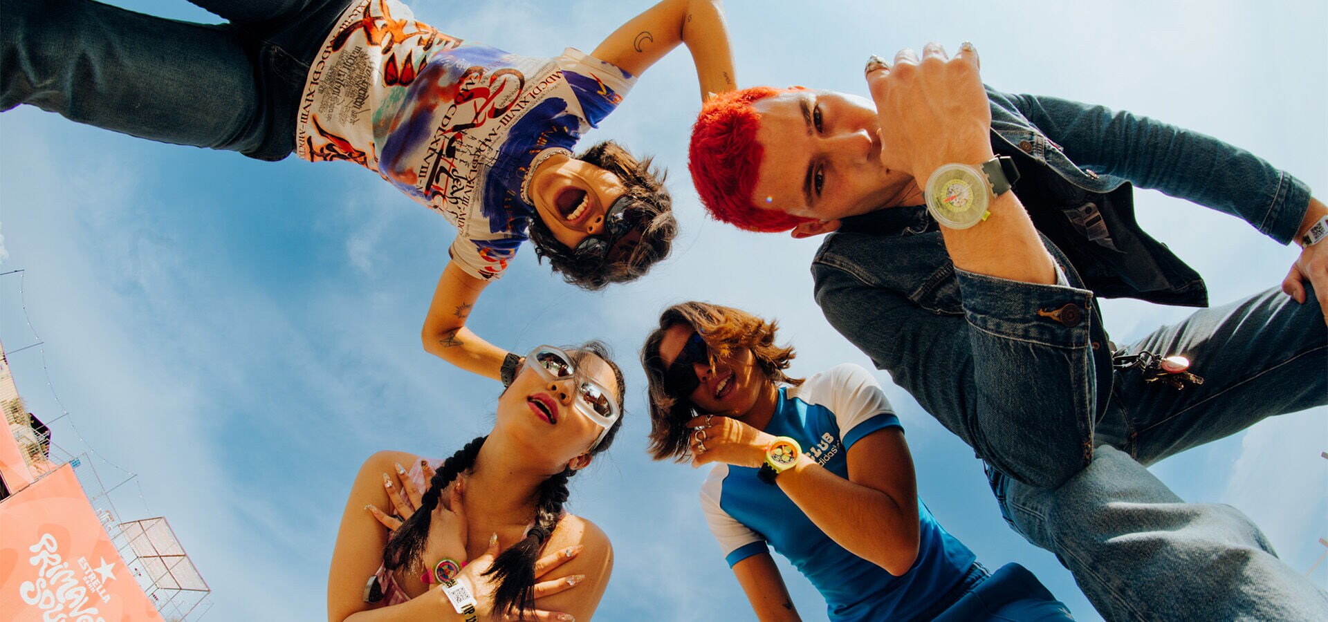 Four young people wearing the Swatch NEON collection at the Primavera Sound festival