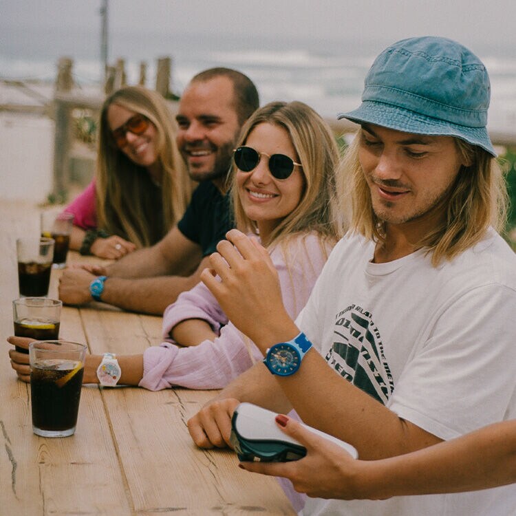 Group of people on a table with a swatchpay