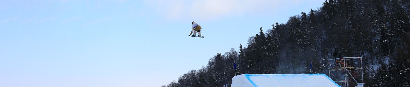 Picture of a man who is snowboarding Picture of a man who is snowboarding