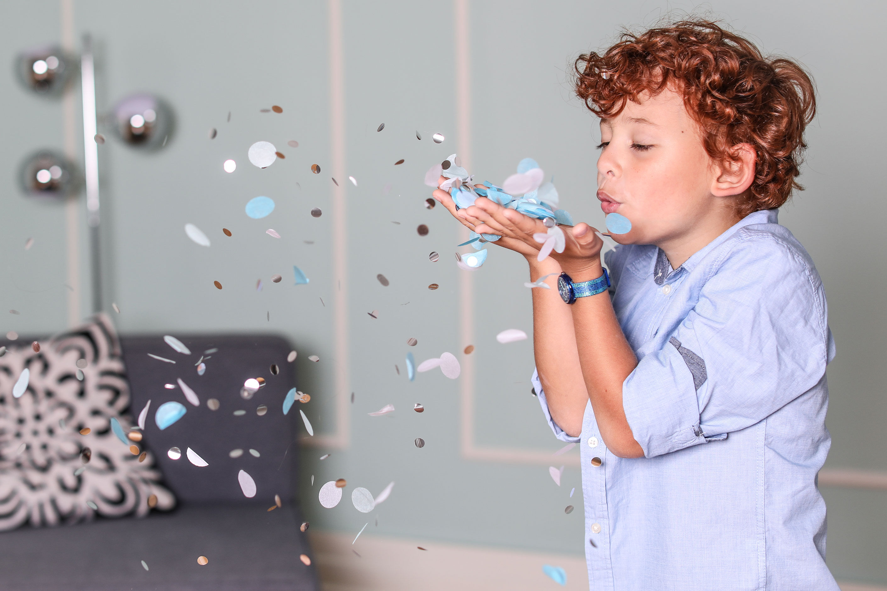 boy playing with confetti