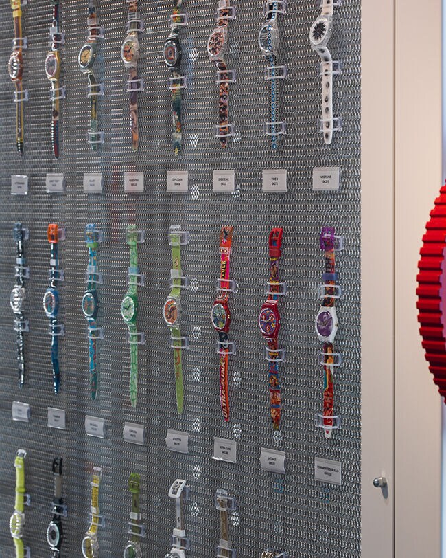 A panel displaying Swatch watches throughout the years 