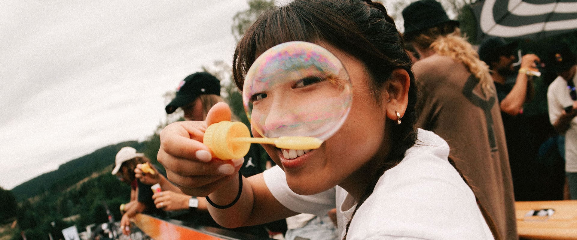 Skater Mami Tezuka blowing bubbles from the top of the Swatch truck