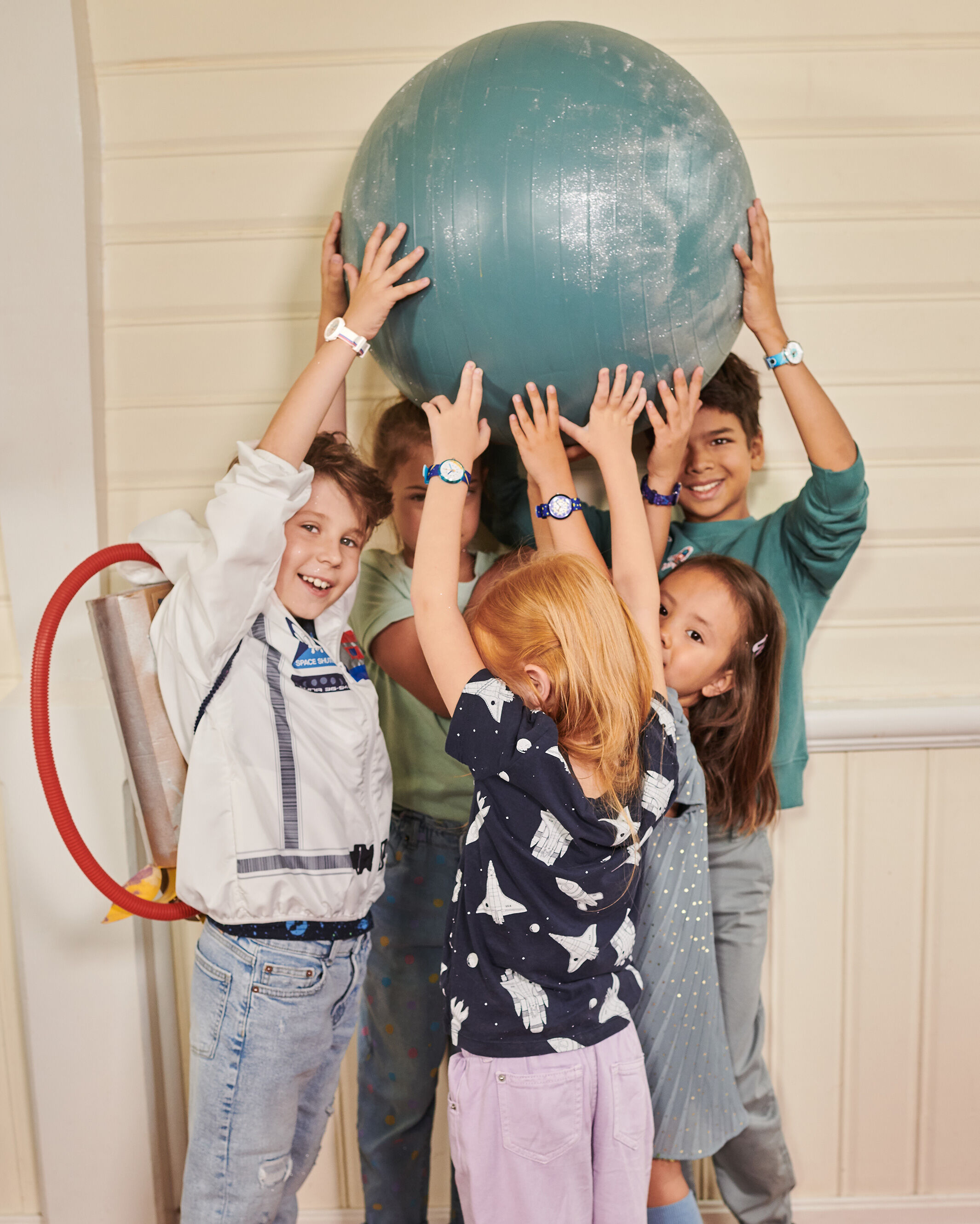 Kids holding a big ball
