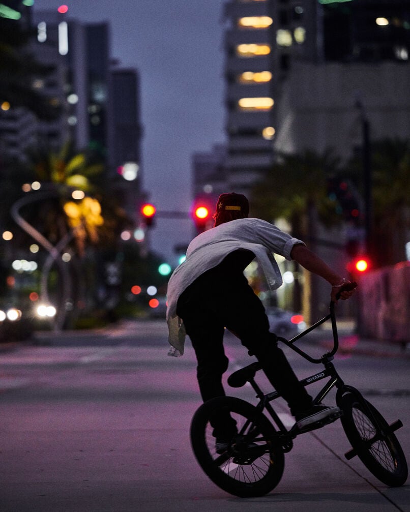 Chad Kerley doing BMX tricks in the street