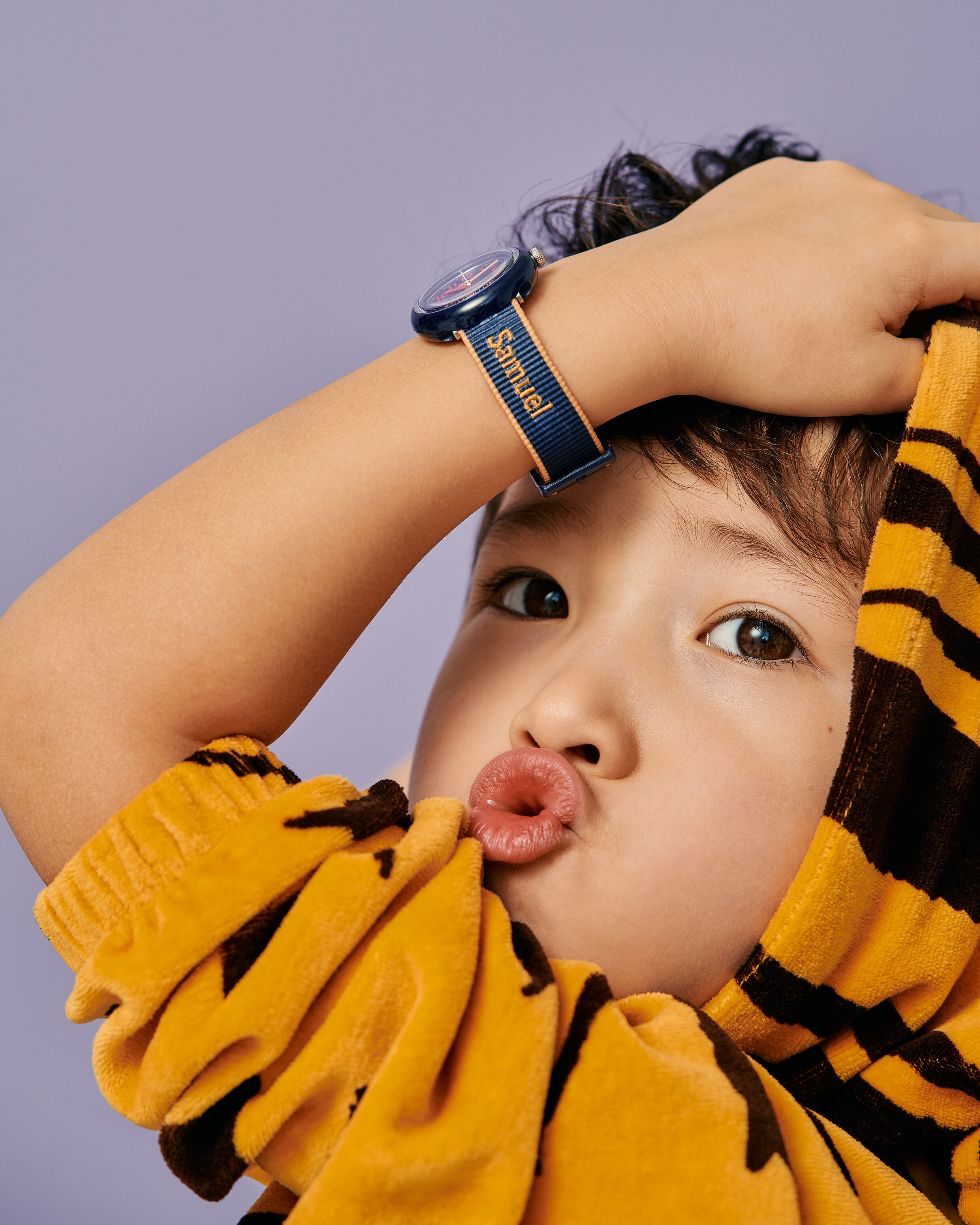 Kid wearing a personalized Flik Flak watch