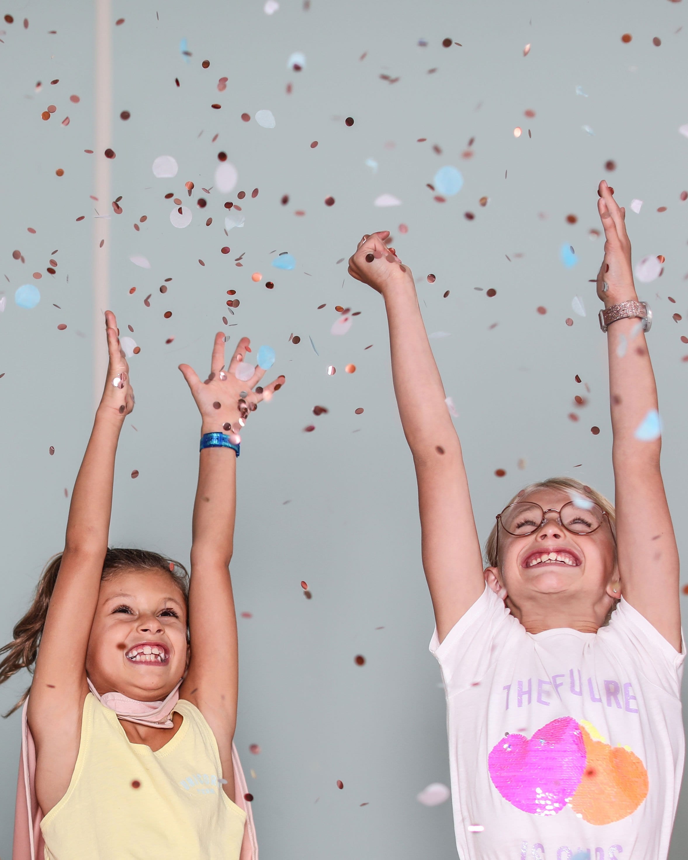 children playing with confetti